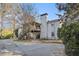 An exterior angle showcases a white-brick house, a tall chimney, and a covered deck with stairs in the backyard at 4433 Canary Ct, Lithia Springs, GA 30122