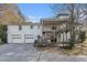 Exterior shot of the home, featuring the garage, a back porch, and the backyard at 4433 Canary Ct, Lithia Springs, GA 30122