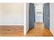 Hallway featuring hardwood floors and stylish doors leading to other rooms at 4433 Canary Ct, Lithia Springs, GA 30122