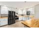 Bright kitchen with stainless steel appliances, butcher block counters, and white cabinetry at 4433 Canary Ct, Lithia Springs, GA 30122