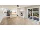 Open-concept living area with kitchen, fireplace, and access to an outdoor deck at 4433 Canary Ct, Lithia Springs, GA 30122