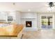 Open-concept living area featuring a brick fireplace and sliding doors to the outside at 4433 Canary Ct, Lithia Springs, GA 30122