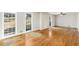 Bright living room with hardwood floors and large windows providing natural light at 4433 Canary Ct, Lithia Springs, GA 30122