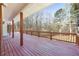Spacious back deck is perfect for outdoor entertaining with views of wooded lot at 5595 Rolling Acres Ln, Cumming, GA 30028