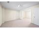 Finished basement offers versatile space with neutral carpet and recessed lighting at 5595 Rolling Acres Ln, Cumming, GA 30028
