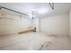 Functional garage featuring an electric door and ample interior space at 5595 Rolling Acres Ln, Cumming, GA 30028