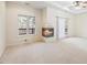 Bright main bedroom features cozy fireplace and private deck access at 5595 Rolling Acres Ln, Cumming, GA 30028