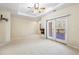 Spacious main bedroom features fireplace, private balcony, and ceiling fan at 5595 Rolling Acres Ln, Cumming, GA 30028