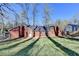 Backyard with a flat grassy area, a brick home, and a chain link fence at 642 Dogwood Dr, Lawrenceville, GA 30046