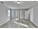 Bedroom with light wood flooring, neutral paint, and access to multiple closets at 642 Dogwood Dr, Lawrenceville, GA 30046