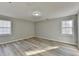 A vacant bedroom with lots of natural light and new vinyl flooring at 642 Dogwood Dr, Lawrenceville, GA 30046