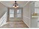 Dining room features hardwood floors, modern lighting, and an open layout at 642 Dogwood Dr, Lawrenceville, GA 30046