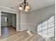 A well-lit dining room featuring new vinyl flooring and an elegant chandelier, with easy access to other rooms at 642 Dogwood Dr, Lawrenceville, GA 30046