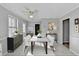 Bright dining room with modern decor, contemporary lighting and furniture at 642 Dogwood Dr, Lawrenceville, GA 30046