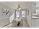 Dining room with modern accents, new hardwood, and access to the kitchen at 642 Dogwood Dr, Lawrenceville, GA 30046