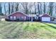 Charming brick ranch home featuring an attached garage and well-maintained lawn at 642 Dogwood Dr, Lawrenceville, GA 30046