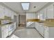 Spacious kitchen with white cabinets, tile floors, and modern appliances at 642 Dogwood Dr, Lawrenceville, GA 30046