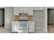 Simple kitchen features a white electric range and ample cabinet space at 642 Dogwood Dr, Lawrenceville, GA 30046