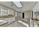 Open kitchen leading to dining area with light-filled windows at 642 Dogwood Dr, Lawrenceville, GA 30046