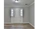 Bright and airy living room featuring neutral paint and modern flooring at 642 Dogwood Dr, Lawrenceville, GA 30046