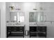 Well-lit bathroom with double vanity, granite countertops, and stylish mirrors over marble floors at 2019 Mason Mill Rd, Decatur, GA 30033