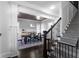 Elegant dining room features crown molding, gray walls, dark floors, decorative ceiling, and staircase at 2019 Mason Mill Rd, Decatur, GA 30033