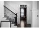 A bright hallway featuring white walls, dark trim and staircase with carpet at 2019 Mason Mill Rd, Decatur, GA 30033