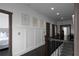 Upstairs hallway featuring dark hardwood floors and decorative wall paneling at 2019 Mason Mill Rd, Decatur, GA 30033