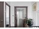 Bright hallway with elegant wainscoting, stained door frames, and views into adjacent rooms at 2019 Mason Mill Rd, Decatur, GA 30033