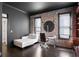 Home office featuring a modern desk, a stylish chaise lounge, and exposed brick walls at 2019 Mason Mill Rd, Decatur, GA 30033