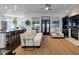 Bright living room with a fireplace, a ceiling fan, and access to the outside patio at 2019 Mason Mill Rd, Decatur, GA 30033