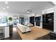 Open concept living room with fireplace, built-in shelving, and a view to the outdoor patio at 2019 Mason Mill Rd, Decatur, GA 30033