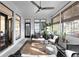 Comfortable sunroom with a ceiling fan, ample natural light, and stylish furniture arrangement at 2019 Mason Mill Rd, Decatur, GA 30033