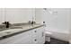Bathroom featuring double sinks, granite countertops, and a soaking tub at 2848 Tanner Lake Nw Trl, Marietta, GA 30064