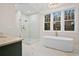 Elegant bathroom boasting a freestanding tub, glass shower and marble floors at 2848 Tanner Lake Nw Trl, Marietta, GA 30064