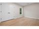 Bright bedroom featuring double doors, modern trim, and hardwood floors at 2848 Tanner Lake Nw Trl, Marietta, GA 30064