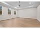 Spacious bedroom with tray ceiling and multiple windows overlooking mature trees at 2848 Tanner Lake Nw Trl, Marietta, GA 30064