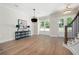Spacious dining area with hardwood floors, stylish lighting, and views of the entryway and front door at 2848 Tanner Lake Nw Trl, Marietta, GA 30064