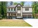 Beautiful exterior view of a two-story home with gray trim, white siding, and a covered front porch at 2848 Tanner Lake Nw Trl, Marietta, GA 30064