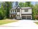 Stunning two-story home with a manicured lawn, a two-car garage, and a welcoming front porch at 2848 Tanner Lake Nw Trl, Marietta, GA 30064