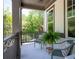 Inviting front porch with seating, offering a cozy outdoor space with views of the surrounding landscape at 2848 Tanner Lake Nw Trl, Marietta, GA 30064