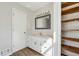 Bathroom features a white vanity with granite counters, framed mirror and modern lighting at 6165 Short St, Canton, GA 30114