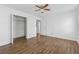 Comfortable bedroom featuring wood-look floors, a ceiling fan, and a closet at 6165 Short St, Canton, GA 30114