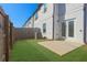 Private back yard featuring a wooden fence, grassy area, and concrete patio at 76 Auburn Run Ln, Auburn, GA 30011