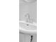 Close up of a white bathroom sink with chrome faucet and simple, elegant design at 76 Auburn Run Ln, Auburn, GA 30011