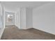 Spacious bedroom with neutral carpeting, white walls, and ample natural light at 76 Auburn Run Ln, Auburn, GA 30011