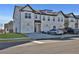 Beautiful townhome with a traditional white brick exterior and attached garages at 76 Auburn Run Ln, Auburn, GA 30011