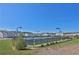 Community tennis courts surrounded by green space and residential buildings at 76 Auburn Run Ln, Auburn, GA 30011