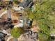 Aerial view of property showcasing the house, landscaping, pool, and surrounding greenery at 302 W Country Dr, Johns Creek, GA 30097