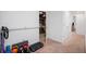 Carpeted basement area with gym equipment, offering a functional and versatile space at 302 W Country Dr, Johns Creek, GA 30097